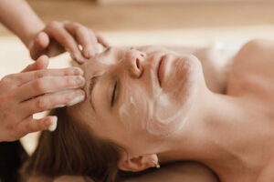 woman facial massage healthy skin